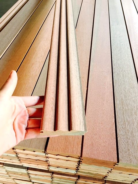 Hand holding a timber paneling profile